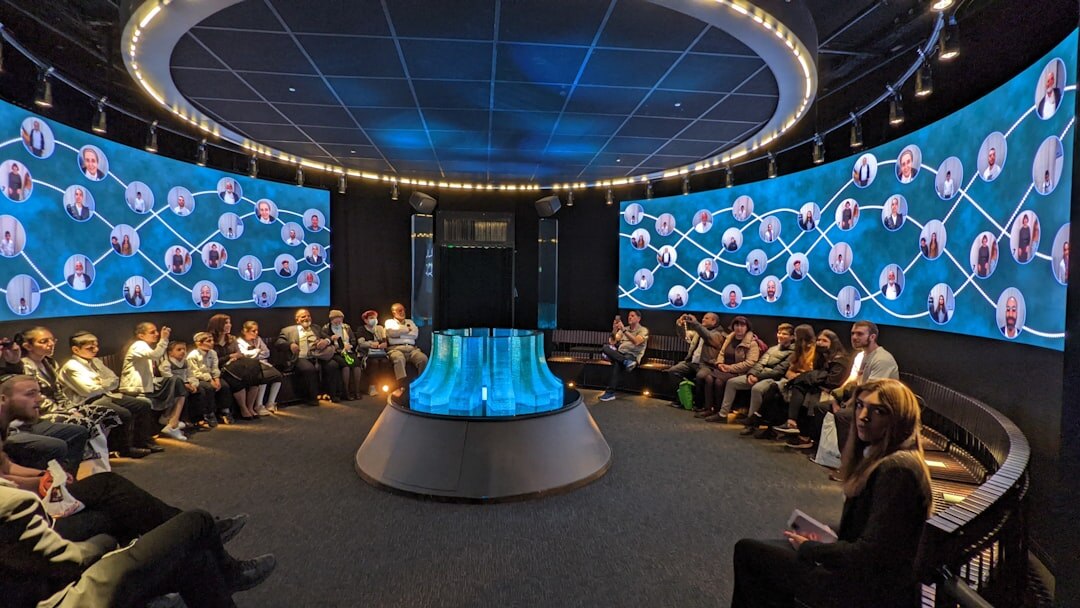 Panel discussion on stage with media professionals and an engaged audience